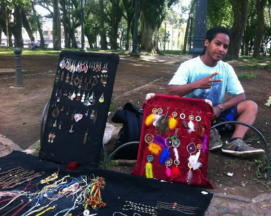 Deni sells his handicrafts in different places around downtown. Sometimes he stays at Eufrasio’s Correia Square, and other times at XV de Novembro  (Photo: Lucas Panek)